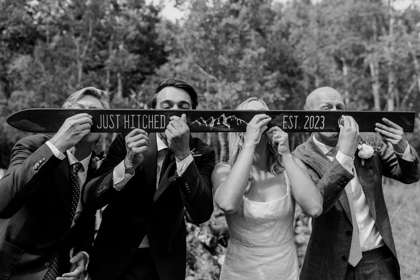 people drinking from a wedding shot ski